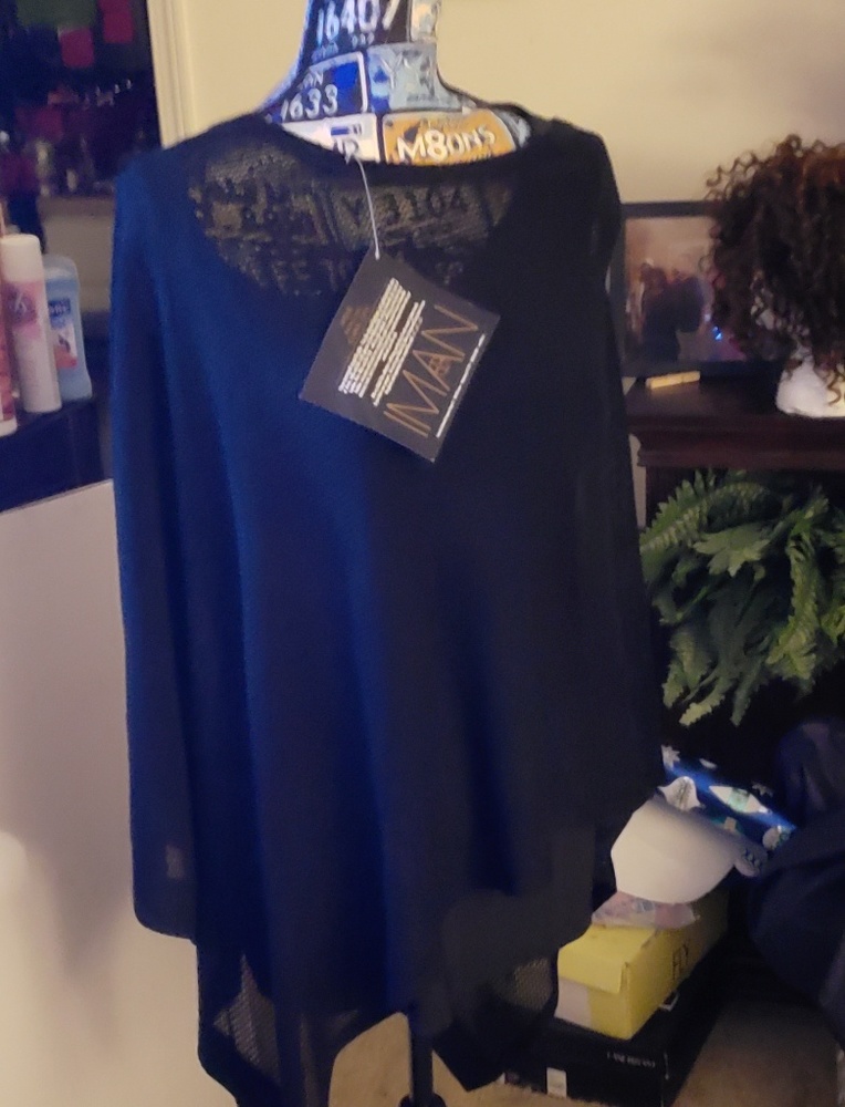 Black IMAN poncho.